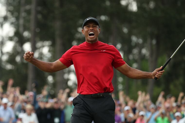 Tiger Woods celebrates after winning last year's Masters.