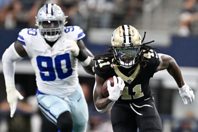 New Orleans running back Alvin Kamara breaks away with Dallas Cowboys defensive end DeMarcus Lawrence in pursuit during the Saints' easy win.