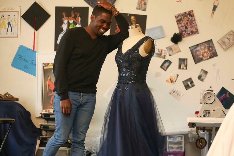 Michael Thomas, 25, in his Philadelphia studio with a prom dress he's making for a Baldwin School student.