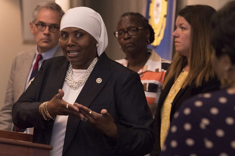 Movita Johnson-Harrell, supervisor of the Philadelphia District Attorney's Victim Witness Services, center, spoke at an Aug. 1 news conference about a new program for family members of homicide victims. Johnson-Harrell, a state House representative from Philadelphia, won a special election in March 2019 and is facing charges after prosecutors accused her of enriching herself by stealing money from a nonprofit she founded to serve the mentally ill and poor who were fighting addiction.