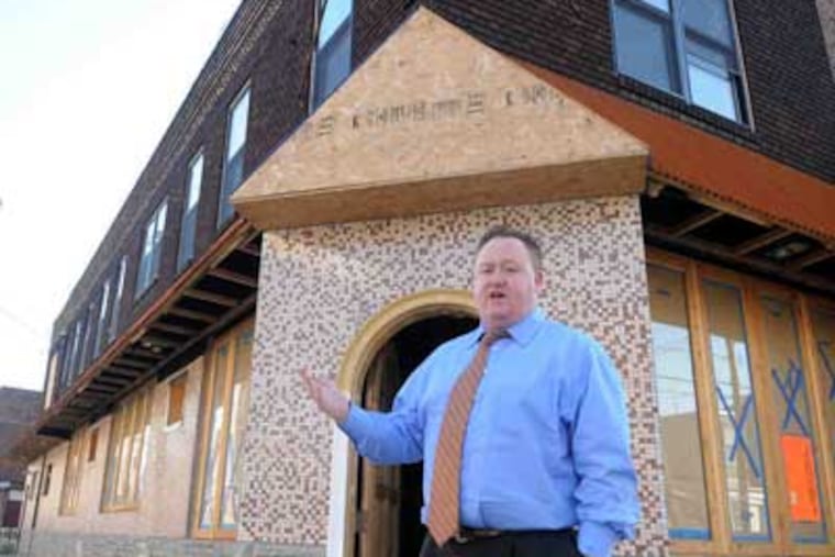 John Longacre outside his not-yet-opened American Sardine Bar, 18th and Federal. He says fears of higher taxes are unfounded.