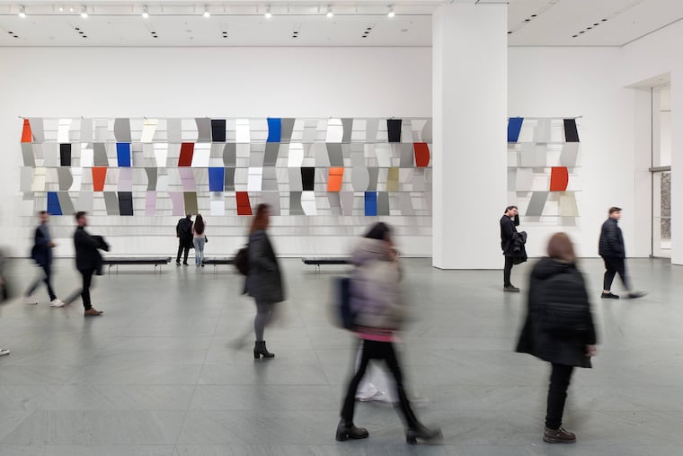Installation view of the exhibition "Ellsworth Kelly: A Centennial Celebration," February 3, 2023 - June 11, 2023. The Museum of Modern Art, New York.
On view is Ellsworth Kelly (American, 1923–2015). "Sculpture for a Large Wall." 1956-57. Anodized aluminum, 104 panels; 11' 5" x 65' 5" x 28" (348 x 1994 x 71.1 cm). The Museum of Modern Art, New York. Gift of Jo Carole and Ronald S. Lauder.