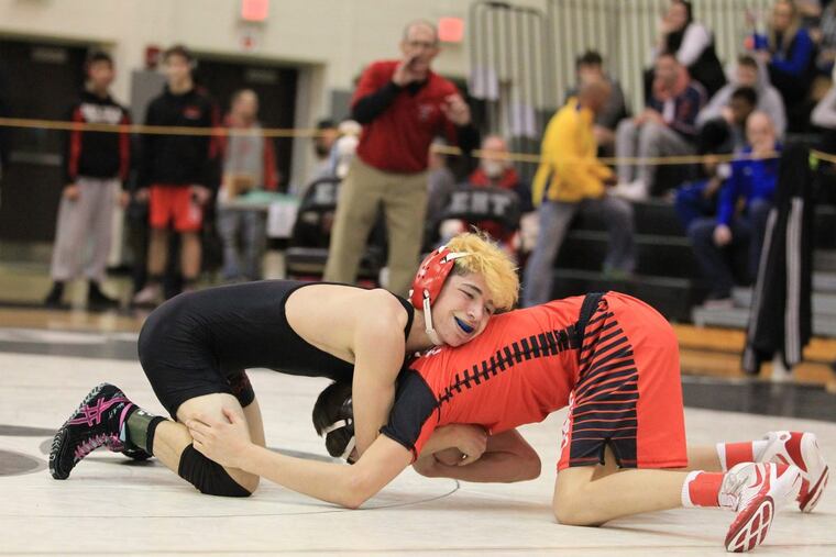 David Iuliucci, left, of St. Joseph- Hammontown and Asa Walton of Delsea wrestle in the 106 pound weight class in the NJSIAA Region 8 quarterfinals at Egg Harbor Twp. on Feb.23, 2018. Iuliucci won by a pin.