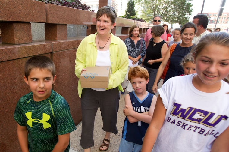 Margie Winters (left) was fired in June after a parent complained about her marriage to another woman. There was an outpouring of support for her. (CHARLES FOX / Staff Photographer)