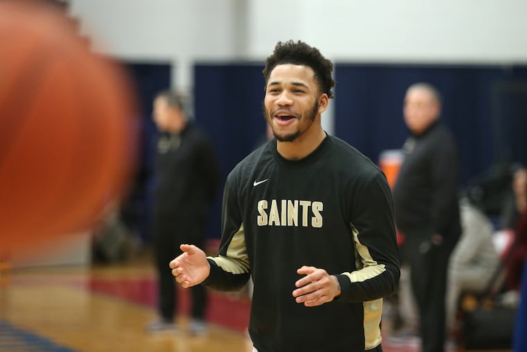 Neumann Goretti football star Shawn Battle has been a part of league and district titles in both football and basketball, and now as the basketball team plays in the PIAA playoffs, he’s also juggling a football recruiting trip to Nebraska. He is shown warming up for their game against Eastern Lebanon County High School on March 8.