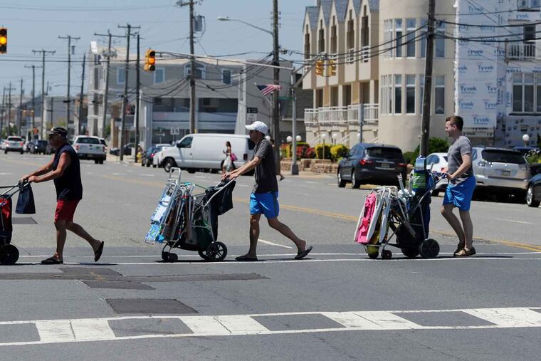 FILE - Pedestrians cross at an intersection down the shore. TOM GRALISH / Staff Photographer