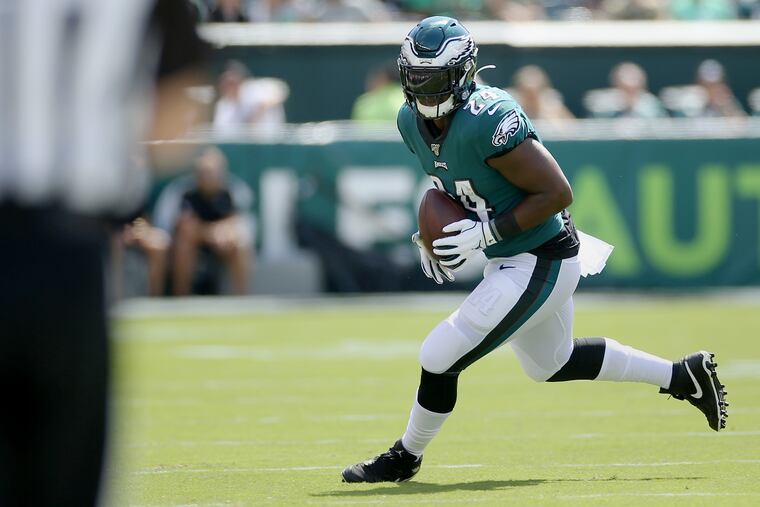 Eagles running back Jordan Howard carries the ball Sunday against the Washington Redskins.