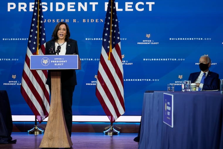 Vice President-elect Kamala Harris speaks as she and President-elect Joe Biden, at right, introduce their nominees and appointees to economic policy posts at The Queen theater, Tuesday, Dec. 1, 2020, in Wilmington, Del.