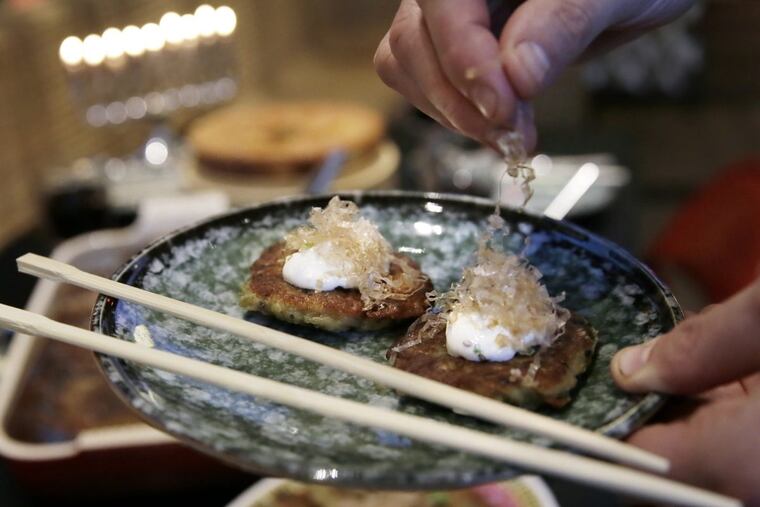 Potato latkes with scallions, garnished with miso crème fraiche and bonito at Cheu Fishtown.