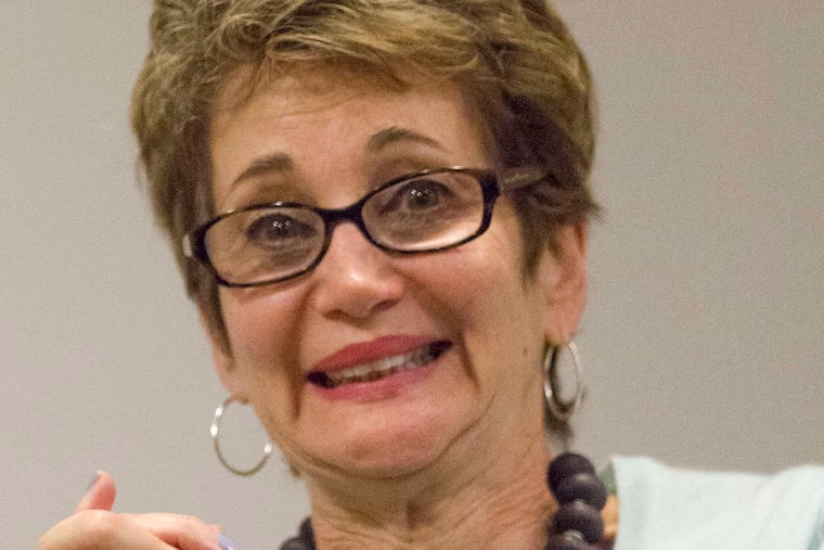 Roz Appell listens to the band rehearse her father's music. She said it was "wonderful and difficult" to hear. Some of it was being performed for the first time.