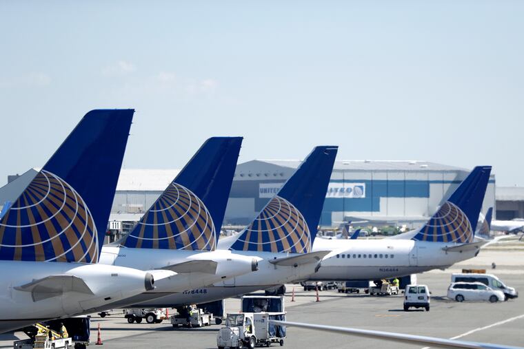 FILE - In this July 18, 2018, file photo, United Airlines commercial jets sit at a gate at Terminal C of Newark Liberty International Airport in Newark, N.J. The 737 Max “must never fly again,” consumer advocate Ralph Nader said. “It’s not a matter of software. It’s a matter of structural design defect: the plane’s engines are too much for the traditional fuselage.” (AP Photo/Julio Cortez, File)