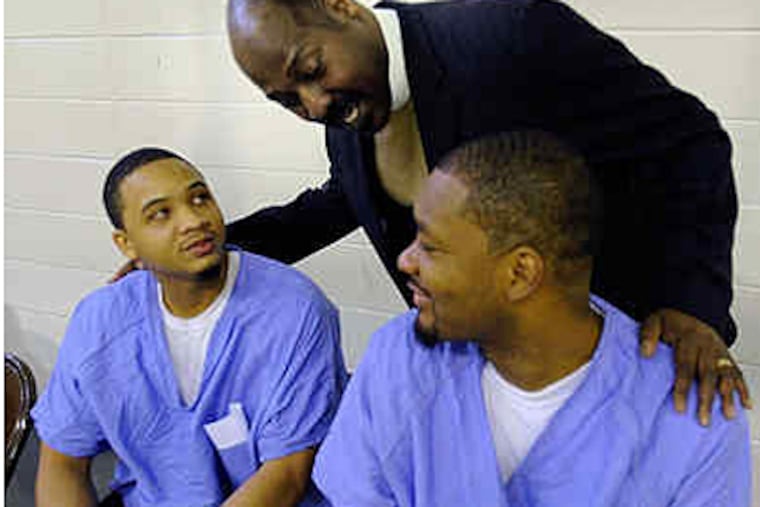 Pastor Ernest McNear with Masud Uqdah (left) and Joe Hall before the graduation.