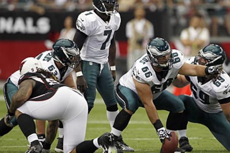 Eagles quarterback Michael Vick has been hit approximately 50 times in three games. (Yong Kim/Staff Photographer)