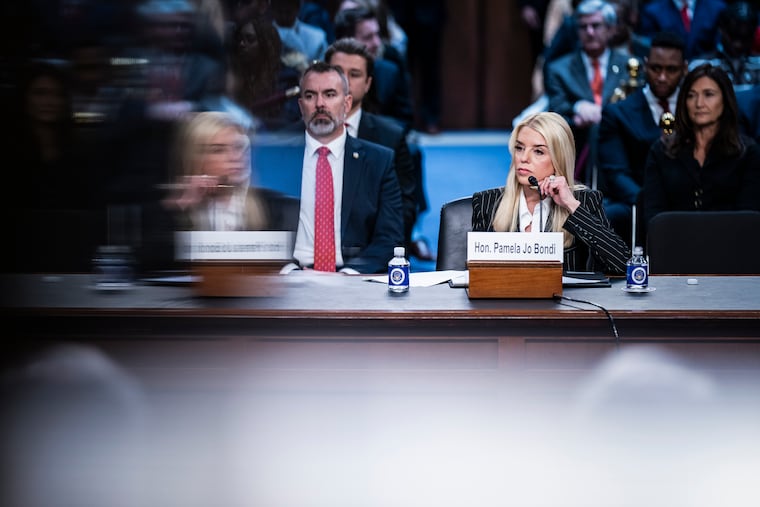 Pam Bondi, right, the U.S. attorney general, oversees the Justice Department that will try the Maduro case.
