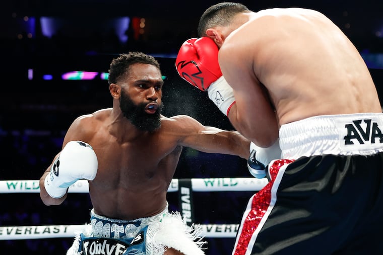 Jaron Ennis lands a body shot against David Avanesyan during a welterweight title fight at the Wells Fargo Center on July 13, 2024.