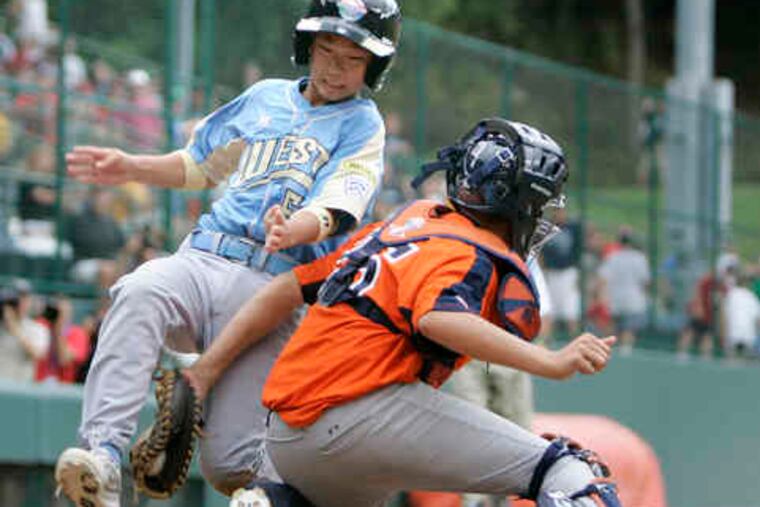 Jeff Ciervo tags Hawaii's Brysen Yoshii at the plate to complete a double play. "They're a great team, and they made those kind of plays," Toms River manager Paul Deceglie said.