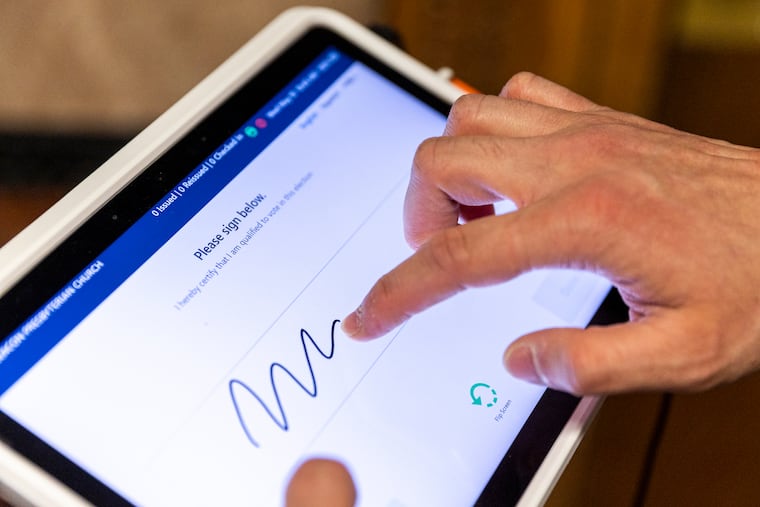 With an electronic poll book, a voter signs a touchscreen with a finger instead of using a pen to sign a paper book.