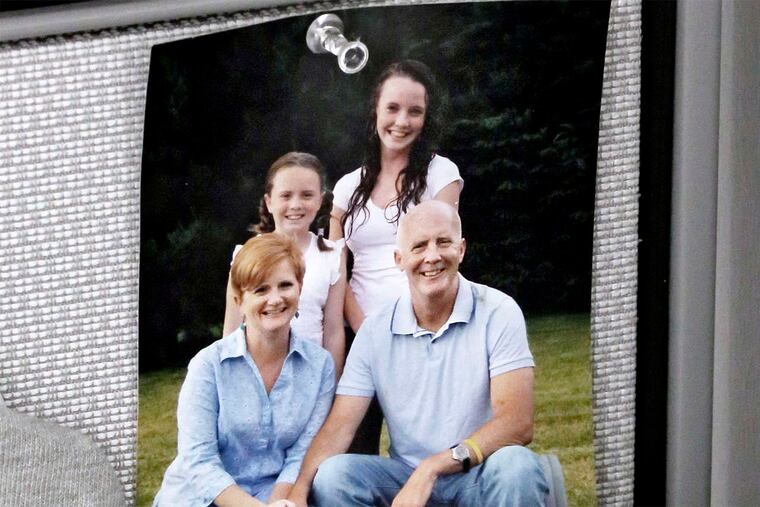 A family photo at Kelly's workspace shortly after his death.