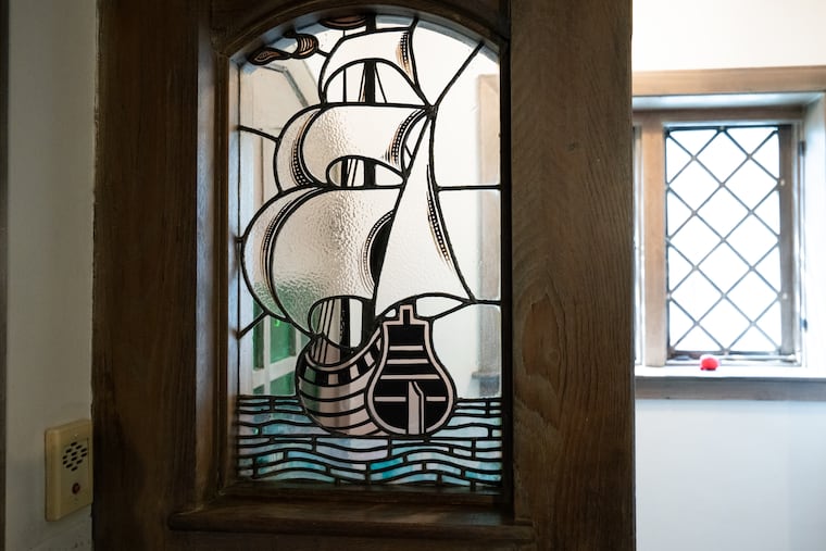 A nautical stained glass window in the front entryway of the Taylors' home. The couple loved the historical details of the old home. 