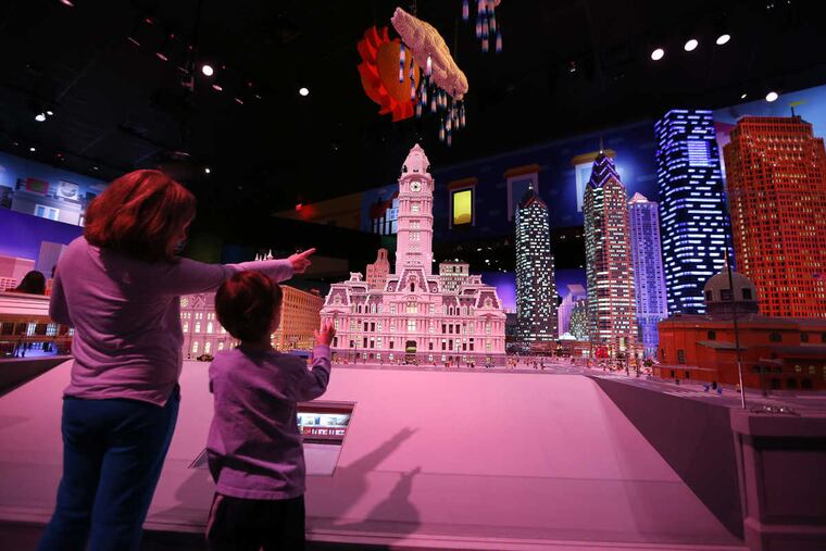 Jenna Harvey, left, 9, and her brother, Billy Harvey, 4, of Pennsburg, PA, look at a Lego rendition of downtown Philadelphia during the grand opening of Legoland Discovery Center in the Plymouth Meeting Mall in Plymouth Meeting, PA on March 31, 2017.