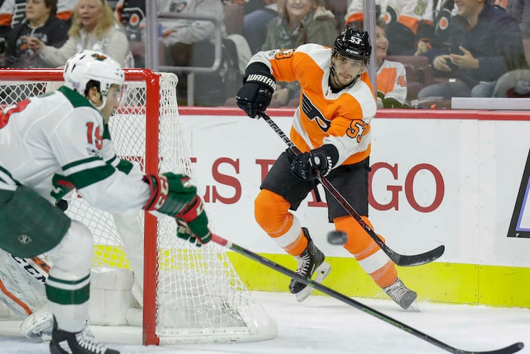 Flyers defenseman Shayne Gostisbehere (right) has a minus-15 rating.