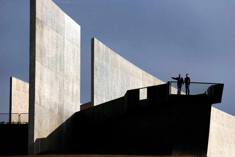 Visitors to the Flight 93 memorial pause on an observation deck before a service of remembrance in Shanksville. Hundreds of victims' relatives were joined by Gov. Wolf and White House officials for the ceremony.