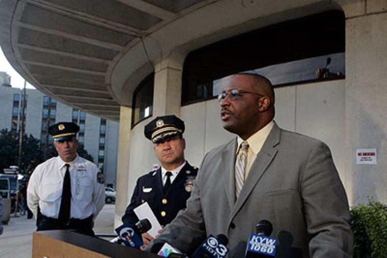 Capt. James Clark, of the Philadelphia Homicide Unit, speaks to the press about the abuse death of 10-year-old Charlenni Ferreria outside the Round House in Center City Phila., Thursday afternoon. Clark called the girl's death one of the worse cases of abuse he has ever seen. (Bonnie Weller / Staff Photographer)