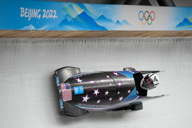 American bobsledder Elana Meyers Taylor drives her toboggan during a monobob training heat at the 2022 Winter Olympics.