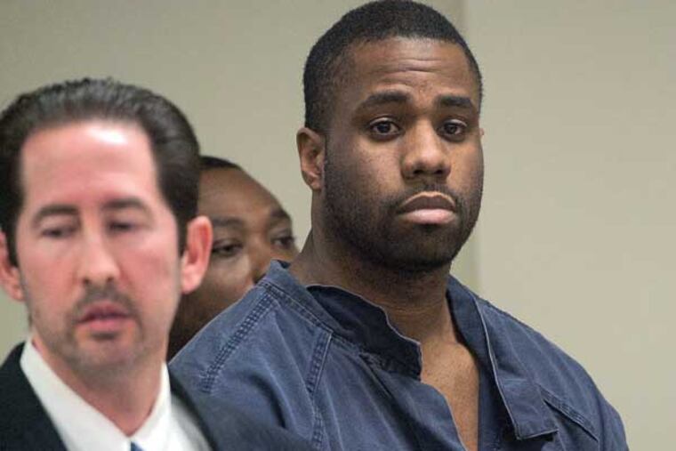 In Camden, NJ, Darrell Crone is arraigned on the charge of murder for the Sunday shooting death of Timothy Loper, Jr., photographed on Dec. 4, 2013. Here, Crone and his lawyer, Scott Cohen. ( APRIL SAUL / Staff )