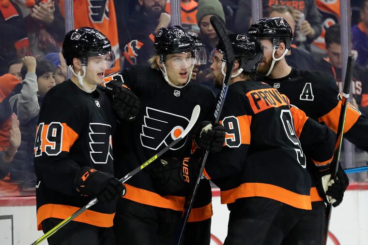 Flyers left winger Oskar Lindblom (second from left) celebrates his goal against the Islanders with teammates Joel Farabee (left), defenseman Ivan Provorov (No. 9) and Sean Couturier on Nov. 16. The Flyers went 10-2-4 in November and led the league with 24 points during the month.