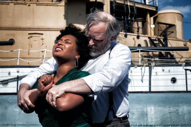 Tai Verley and Nathan Foley (with the USS Olympia in the background) in the Philadelphia Artists’ Collective production of “Iphigenia at Aulis” at Philadelphia Fringe.