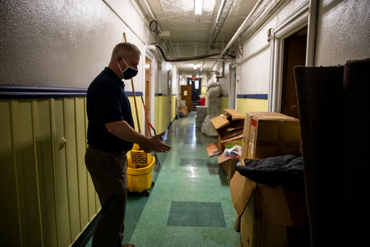 Visitation BVM Principal Ed Coleman shows some of the damage done to the Kensington Catholic school. Thieves broke into the school in the early morning hours of Nov. 30, ripping out copper and metal pipes and stealing computers. The school was flooded, its heater broken, and classes have been cancelled for the rest of the week.