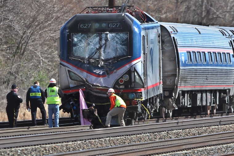The front of the derailed locomotive of the Amtrak Train #89 that struck a backhoe that was on the southbound track , killing two Amtrak employees taht were witht he backhoe An Amtrak passenger train struck a backhoe that was on the track in Chester, PA and the crash led to at least two deaths. Service on the Northeast Corridor between New York and Philadelphia has been suspended. Two Amtrak employees were killed in the crash and that at least 16 people were taken to local hospitals to be treated for injuries. Amtrak said Train 89 was heading from New York to Savannah, Georgia, when it struck a backhoe that was on the track in Chester, about 15 miles outside of Philadelphia. The impact derailed the lead engine of the train. About 341 passengers and seven crew members were on board. 04/03/2016 MICHAEL BRYANT / Staff Photographer