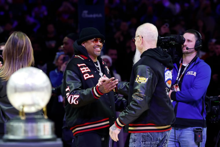 Former Sixers guard Allen Iverson (left) greets former team president Pat Croce during the 25th anniversary ceremony during halftime of the Sixers-Pelicans game on Saturday.