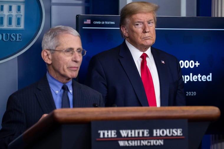 Dr. Anthony Fauci with President Donald Trump (right) at an April news conference.