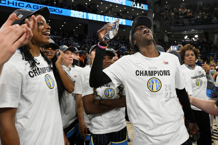 Chicago Sky's Kahleah Copper celebrating with the MVP trophy after being named most valuable player of the series after Chicago defeated the Phoenix Mercury in Game 4 of the WNBA Finals to win the championship Oct. 17, 2021, in Chicago.