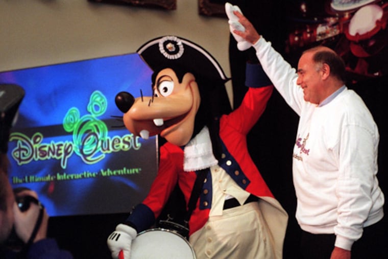 Philadelphia Mayor Ed Rendell gets a high-five from Goofy during a 1998 City Hall news conference announcing plans for a DisneyQuest to be built at Eighth and Market Streets. The project was never completed.