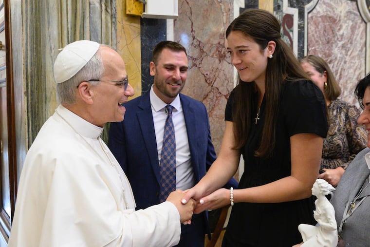 Villanova basketball alumna Maddy Siegrist shakes fellow Villanova alumnus Pope Leo XIV's hand at the Vatican.