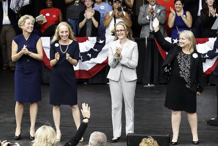In this Sept. 21, 2018 photo, Pennsylvania congressional candidates, from left, Chrissy Houlahan, Mary Gay Scanlon, state Rep. Madeleine Dean and Susan Wild, take part in a campaign rally in Philadelphia. Each of the Democratic candidates won their elections on Nov. 6 and are set to become the first women from Pennsylvania to serve full terms in Congress since 2014. They all were backed by gun-control groups.