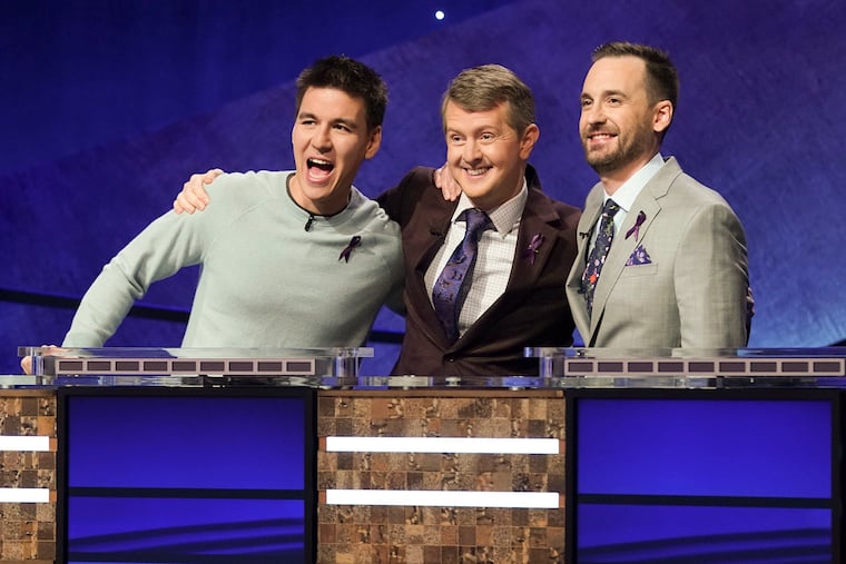 (From left) James Holzhauer, Ken Jennings and Brad Rutter appear on the set of "Jeopardy! The Greatest of All Time," in Los Angeles in December. The tournament will begin to air Tuesday, Jan. 7, at 8 p.m. on ABC.
