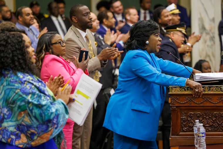 Members of City Council stand behind Philadelphia Mayor Cherelle L. Parker as she gives her budget address at City Hall in March.