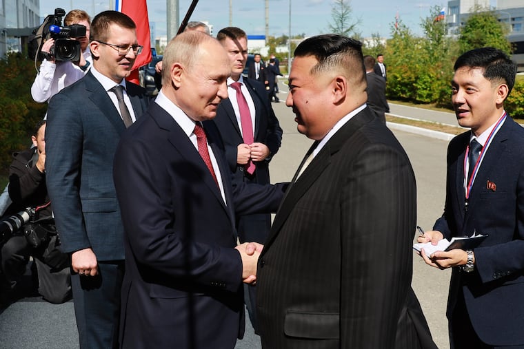 Russian President Vladimir Putin, left, and North Korea's leader Kim Jong Un shake hands during their meeting at the Vostochny cosmodrome outside the city of Tsiolkovsky, about 200 kilometers (125 miles) from the city of Blagoveshchensk in the far eastern Amur region, Russia, on Wednesday.