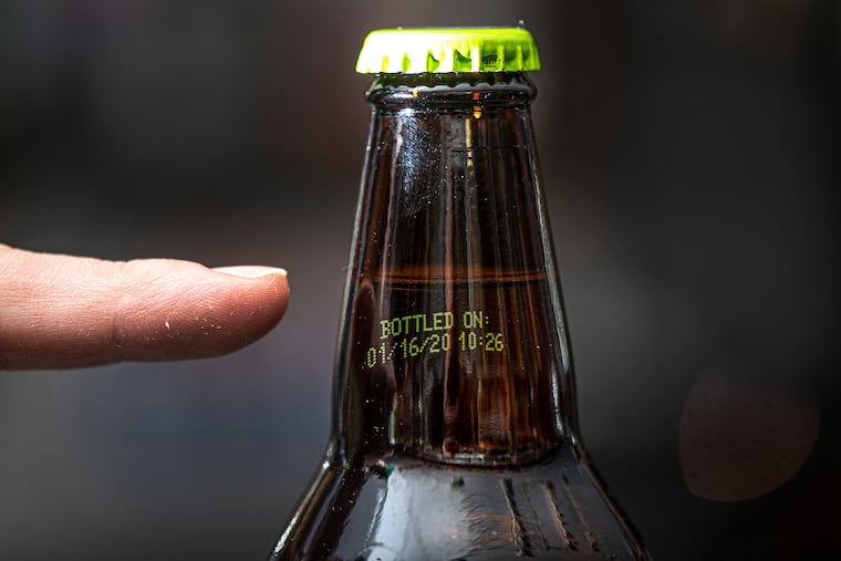 A date code listed printed on a Pale Ale bottle is shown at the Pinocchio’s Beer Garden in Media, PA. Friday, January 24, 2020.