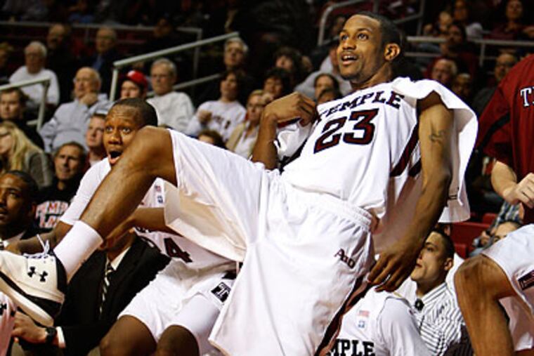 Ramone Moore and Lavoy Allen watched from the bench as Temple finished off its rout of Toledo. (Ron Cortes/Staff Photographer)