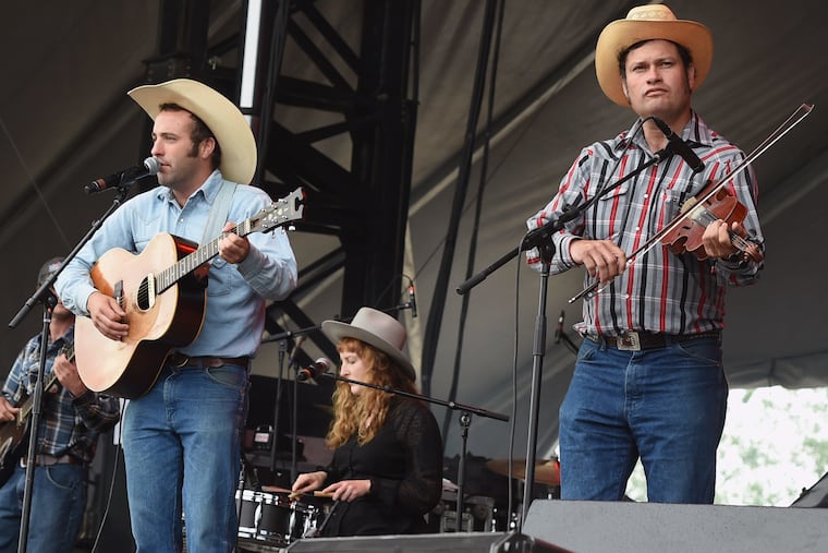 From left, Luke Bell, Heather Littlefield and Matt Kinman performing at the Tree Town Music Festival on May 27, 2017, in Forest City, Iowa.
