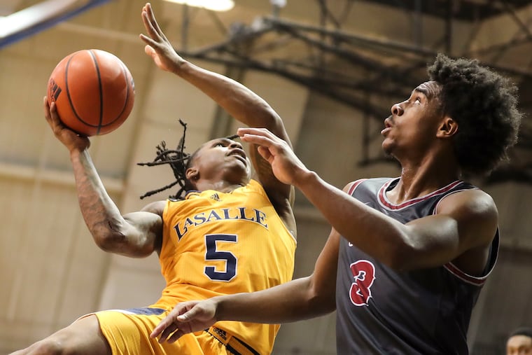 La Salle Explorers guard Khalil Brantley is guarded by St. Joe's Cameron Brown on Monday.