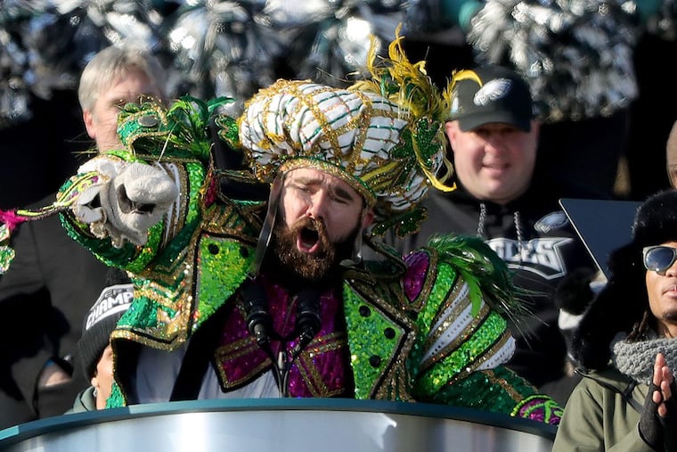 Dressed in Mummers attire, Eagles center Jason Kelce pauses during his colorful speech on the Art Museum steps.