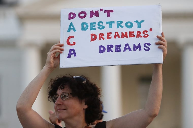 Julia Paley, of Arlington, Va., with the DMV Sanctuary Congregation Network, holds up a sign that reads “DACA Don’t Destroy Dreamers Dreams” during a rally supporting Deferred Action for Childhood Arrivals, or DACA, outside the White House, in Washington on Labor Day. The plan for young immigrants brought to the country illegally as children will be phased out the Trump administration announced Tuesday despite the fact that it was embraced by some top Republicans on Monday. Others have denounced DACA as the beginning of a “civil war” within the party.