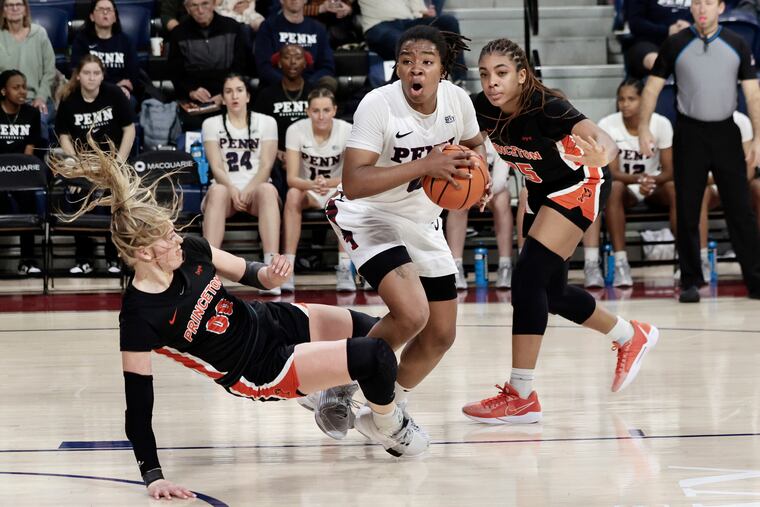 Princeton’s Ellie Mitchell (00) and Penn’s Jordan Obi, center, collide in the second half of their game at the Palestra on Saturday.