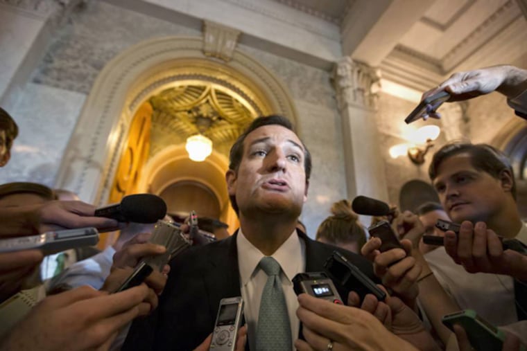 Sen. Ted Cruz, R-Texas talks to reporters as he emerges from the Senate Chamber on Capitol Hill in Washington, Wednesday, Sept 25, 2013, after his overnight crusade railing against the Affordable Care Act, popularly known as "Obamacare." (AP Photo/J. Scott Applewhite)